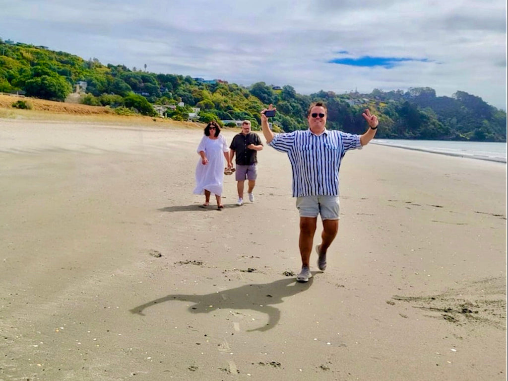 Walking along Onetangi Beach Waiheke Island Motu Tours.